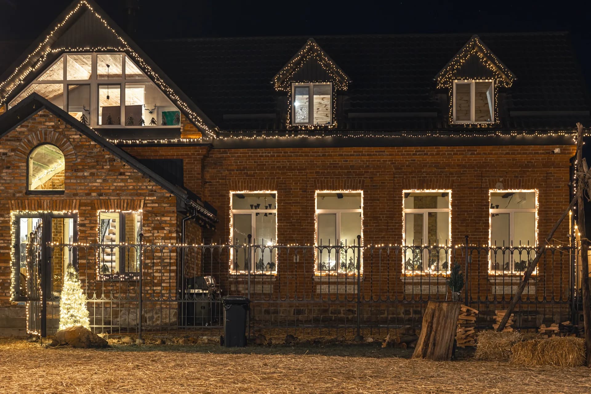 Brick house with Christmas lights at night